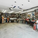 a garage filled with lots of clutter and tools